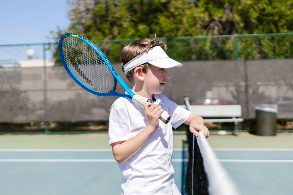 A visor allows for better airflow around the head for a young boy.